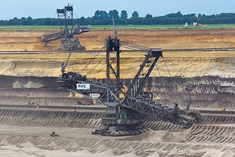 An image of massive bucket wheel excavators digging lignite coal out of the grown at the Garzweiler surface mine in Germany.