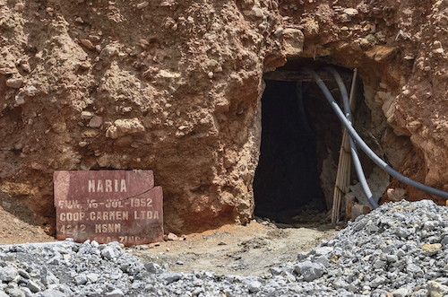 Entrance to a mine carved into the mountainside.